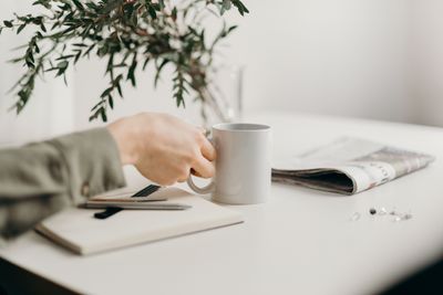 person-holding-white-ceramic-mug-4065886.jpg