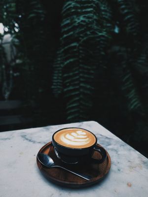 cappuccino-in-cup-on-table-2907301.jpg